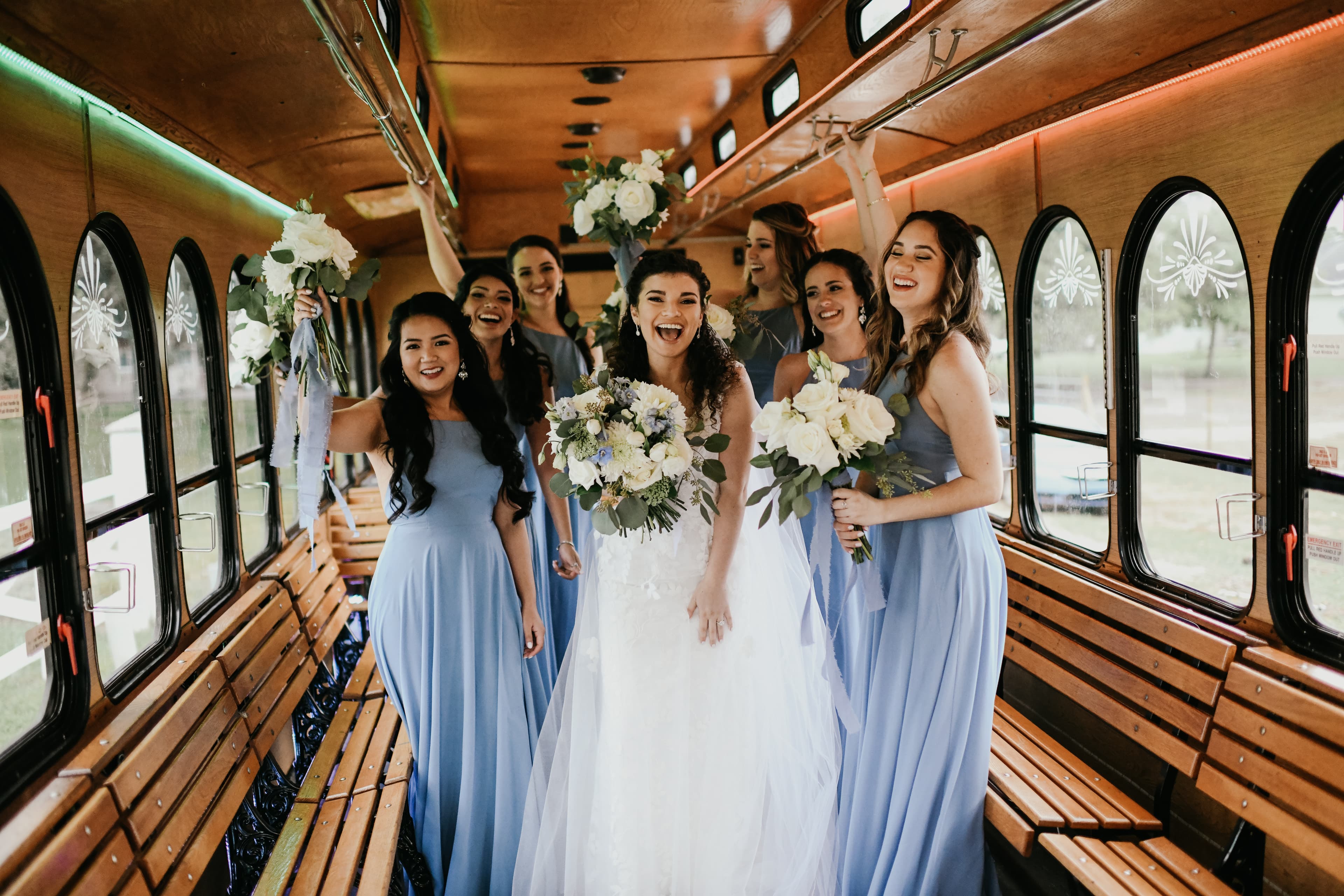 Bridesmaids smiling in trolley